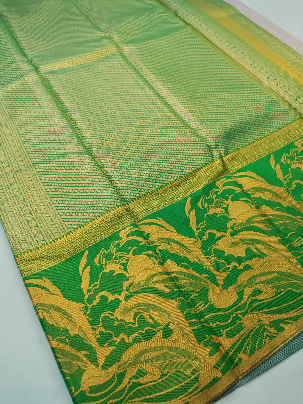 Royal Emerald Vasthrakala Silk Wedding Saree – Dolphin Motif Edition